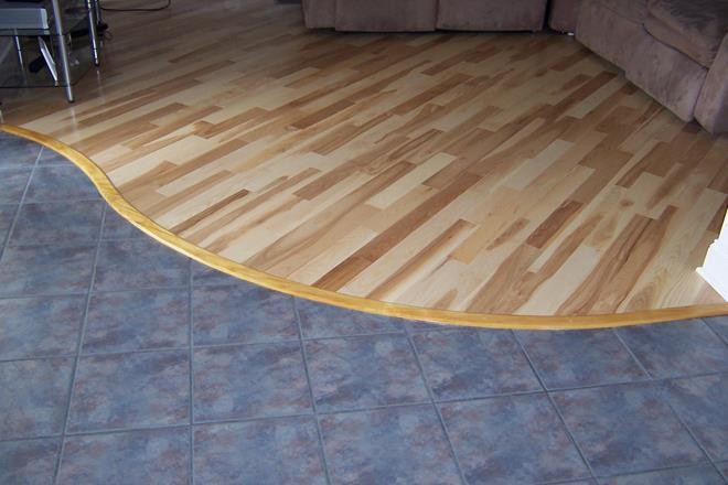 Ash Flooring with Custom-Curved Transition Strip